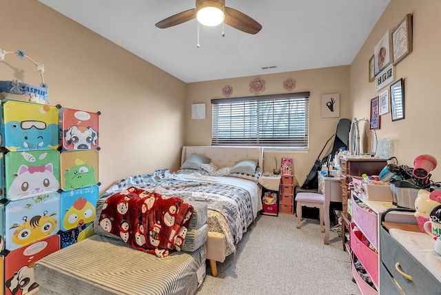 carpeted bedroom with ceiling fan