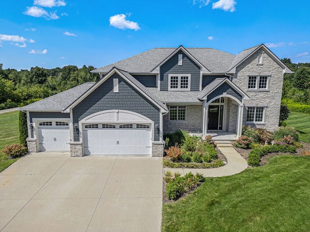 view of front facade featuring a front lawn and a garage