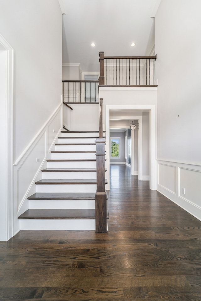 stairway with hardwood / wood-style floors