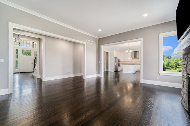 unfurnished living room with a stone fireplace, a wealth of natural light, dark wood-type flooring, and ornamental molding