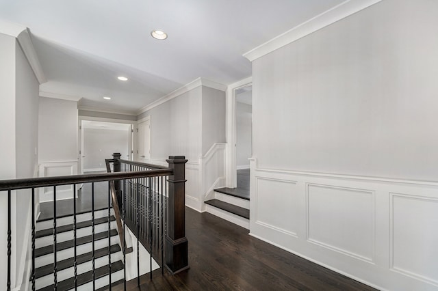 corridor featuring dark hardwood / wood-style flooring and crown molding