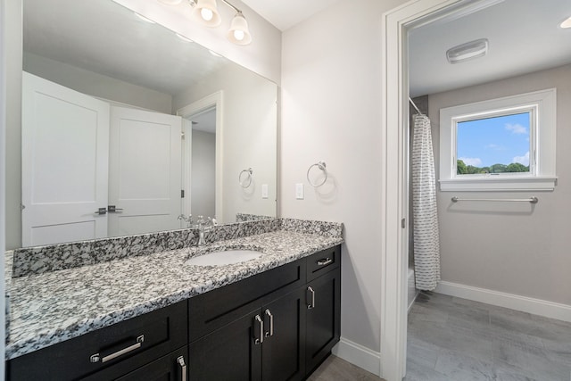 bathroom with a shower with curtain and vanity