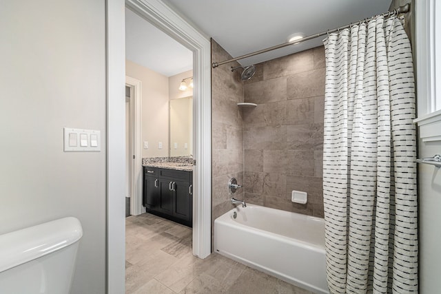 full bathroom with vanity, toilet, and shower / tub combo