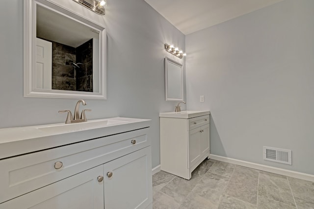 bathroom with a shower and vanity