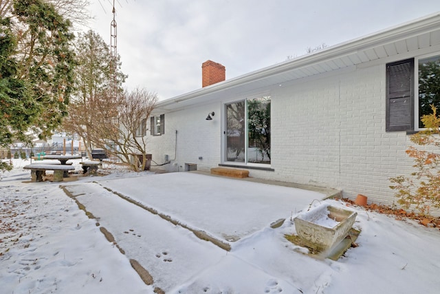 view of snow covered property