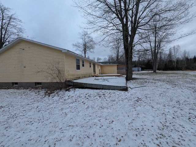 view of snow covered house