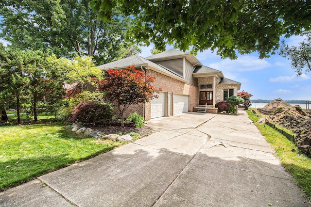 view of front property featuring a front yard and a garage