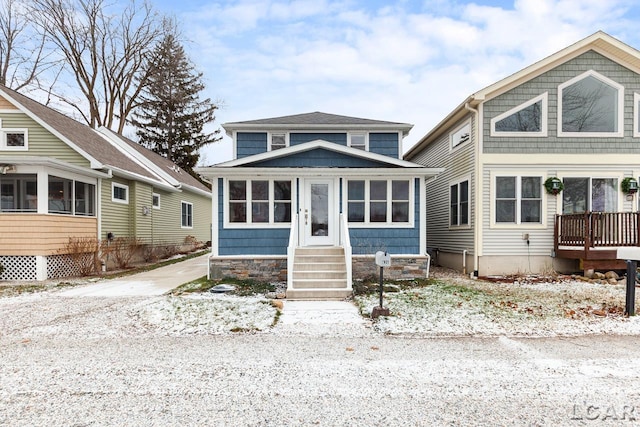 view of front of property featuring a sunroom