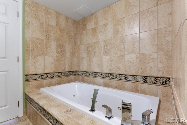 bathroom featuring tile patterned floors, tile walls, and tiled bath