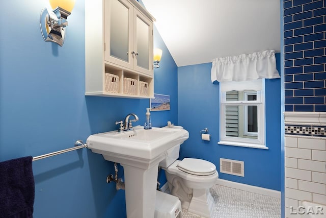 bathroom featuring tile patterned floors and toilet