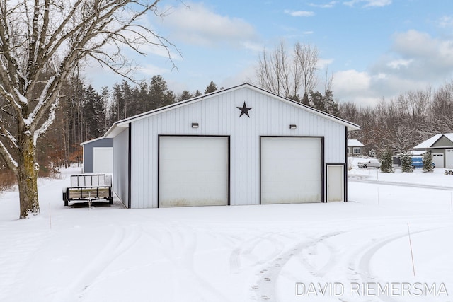 view of snow covered garage