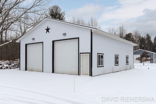 view of snow covered garage