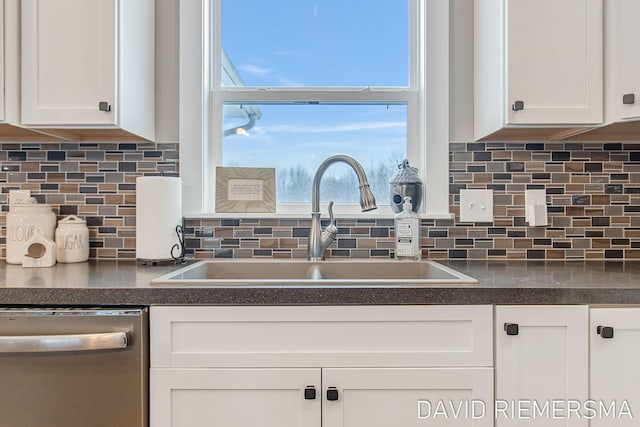 kitchen featuring white cabinetry, sink, and a wealth of natural light