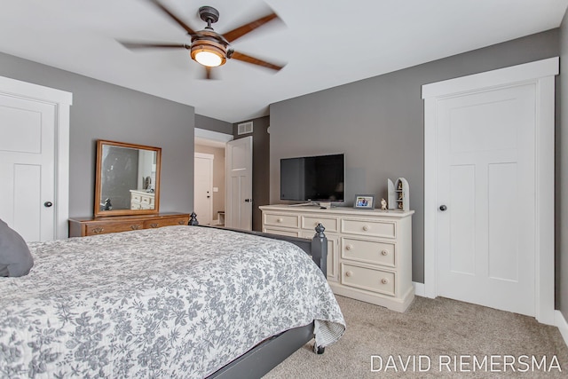 bedroom featuring light carpet and ceiling fan