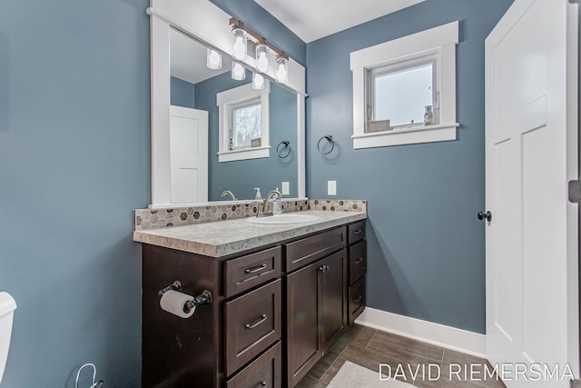 bathroom with a healthy amount of sunlight and vanity