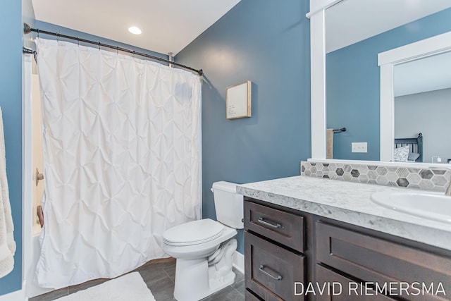 full bathroom featuring vanity, toilet, and shower / bath combo