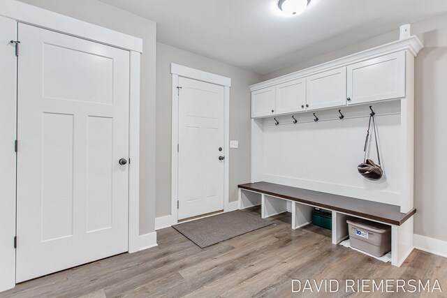 mudroom with light hardwood / wood-style floors