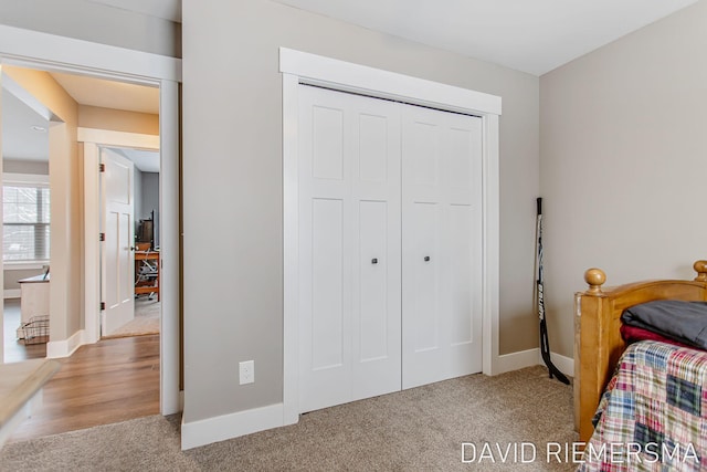 carpeted bedroom with a closet