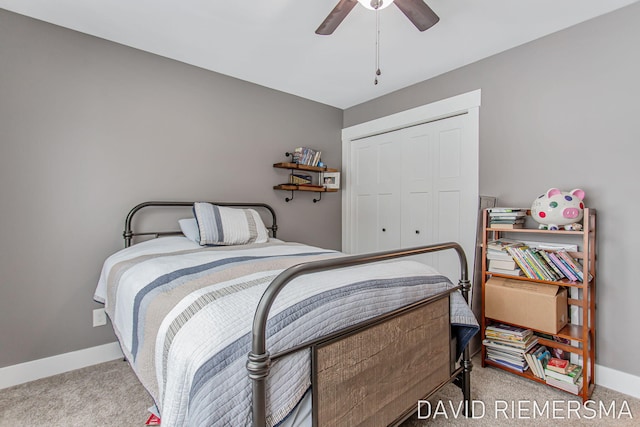 bedroom featuring light carpet, a closet, and ceiling fan