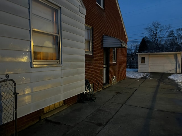 view of home's exterior featuring a garage and an outdoor structure