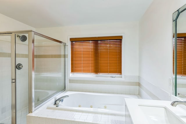 bathroom featuring vanity and plus walk in shower