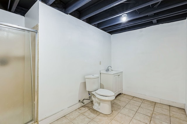 bathroom featuring toilet, sink, a shower with shower door, and tile patterned flooring