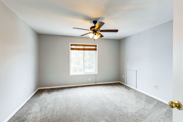 spare room featuring carpet flooring and ceiling fan