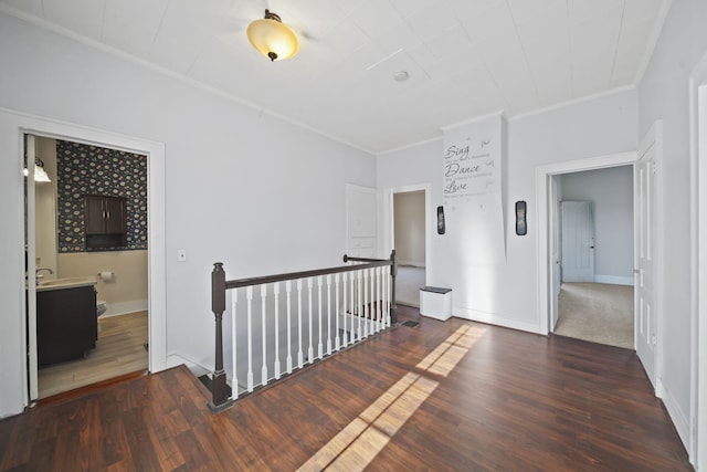 corridor featuring ornamental molding and dark wood-type flooring