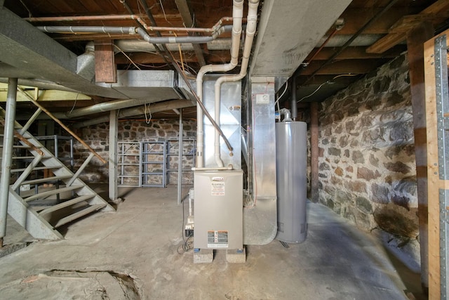 utility room with heating unit and water heater