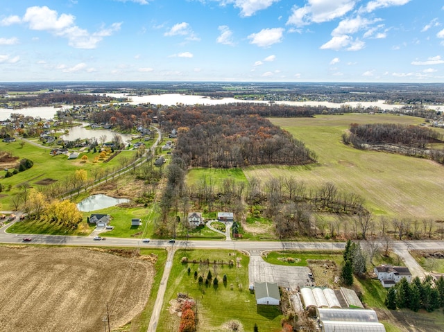 drone / aerial view featuring a water view and a rural view