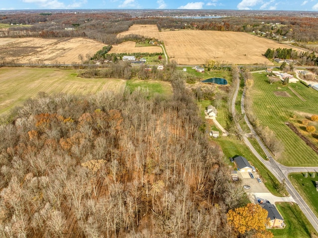 birds eye view of property with a rural view