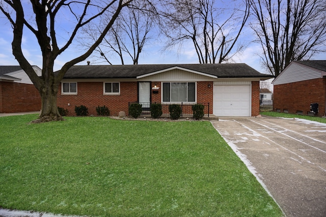 single story home with a front yard and a garage