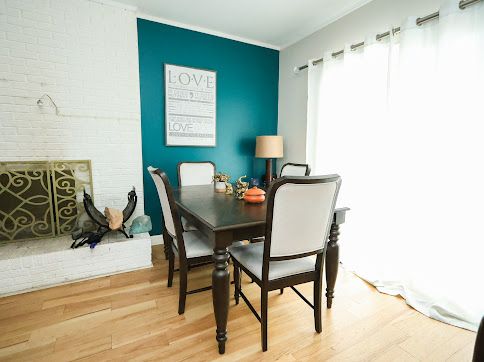 dining space featuring ornamental molding and hardwood / wood-style floors