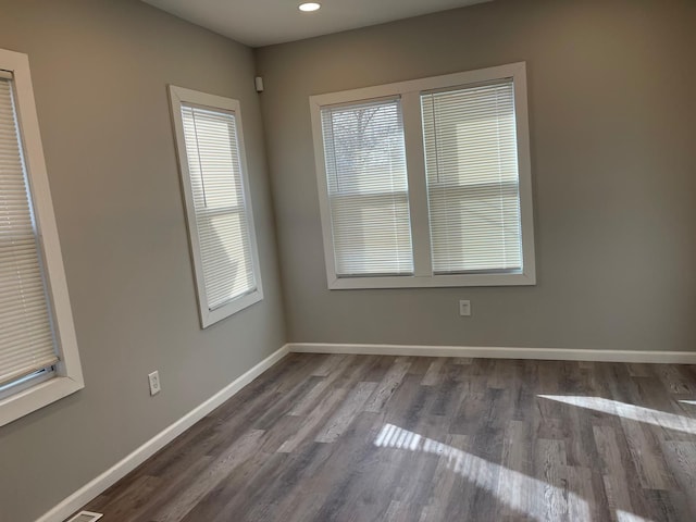 empty room with dark hardwood / wood-style floors