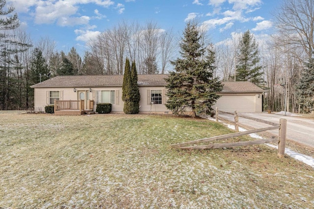 view of front of house featuring a garage and a front yard