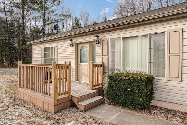 doorway to property with a deck