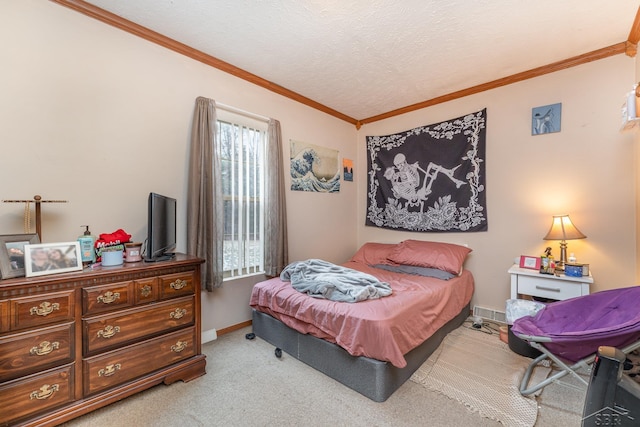 bedroom featuring a textured ceiling, ornamental molding, and light carpet