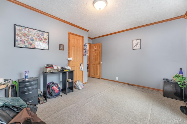 carpeted home office featuring a textured ceiling and ornamental molding