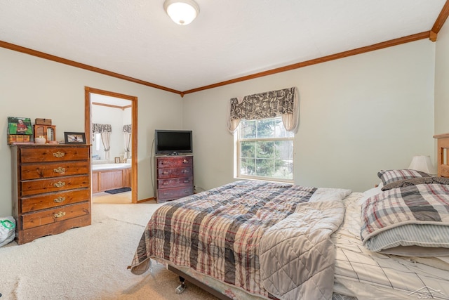 bedroom featuring light carpet, connected bathroom, and crown molding