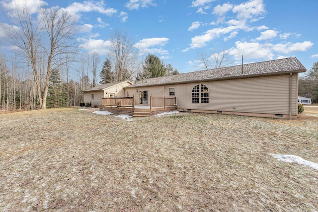 rear view of property with a wooden deck