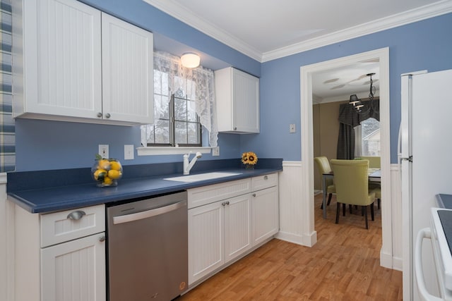 kitchen featuring dishwasher, sink, white cabinets, white refrigerator, and range