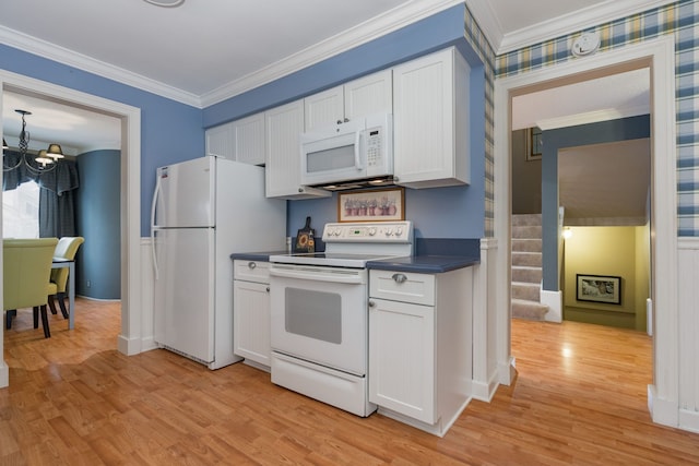 kitchen with an inviting chandelier, white appliances, white cabinetry, light hardwood / wood-style flooring, and ornamental molding