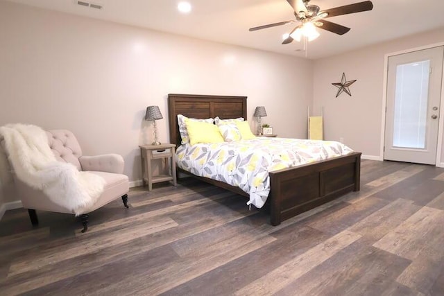 bedroom with ceiling fan and dark wood-type flooring