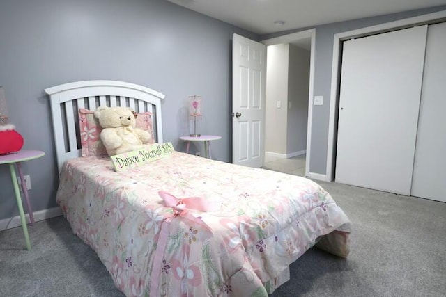 carpeted bedroom with a closet