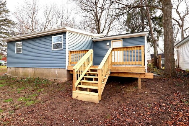 back of property with a deck