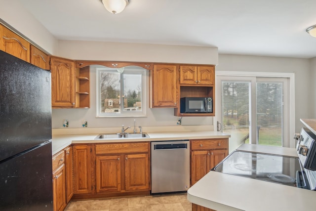 kitchen with sink and black appliances