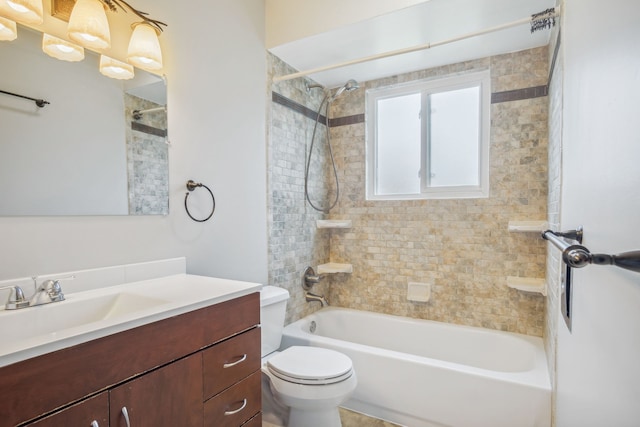 full bathroom featuring vanity, toilet, and tiled shower / bath combo