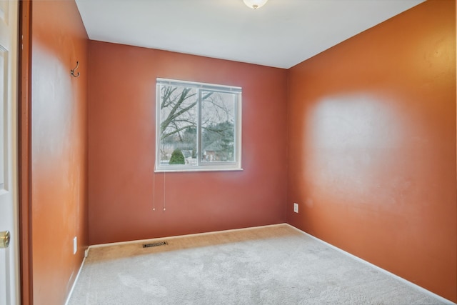 unfurnished room featuring carpet floors