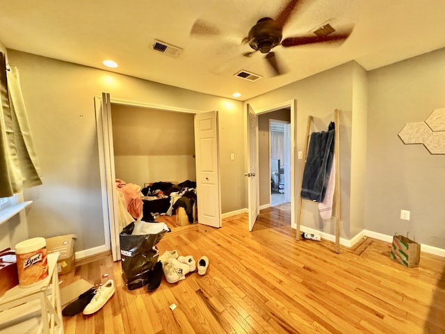 bedroom with ceiling fan and light wood-type flooring