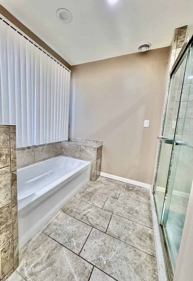 bathroom with independent shower and bath